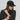 Black AIM Attitude five-panel cap showing front view with adjustable strap and logo detail.