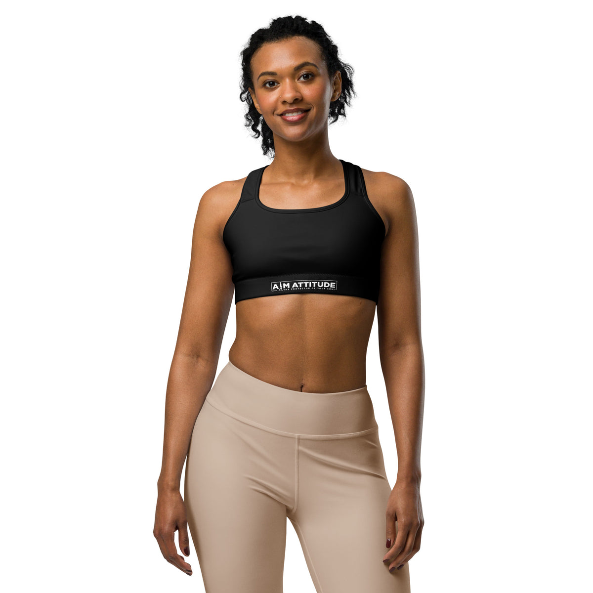 A white AIM ATTITUDE sports bra with supportive straps, designed for active wear and comfortable movement.
