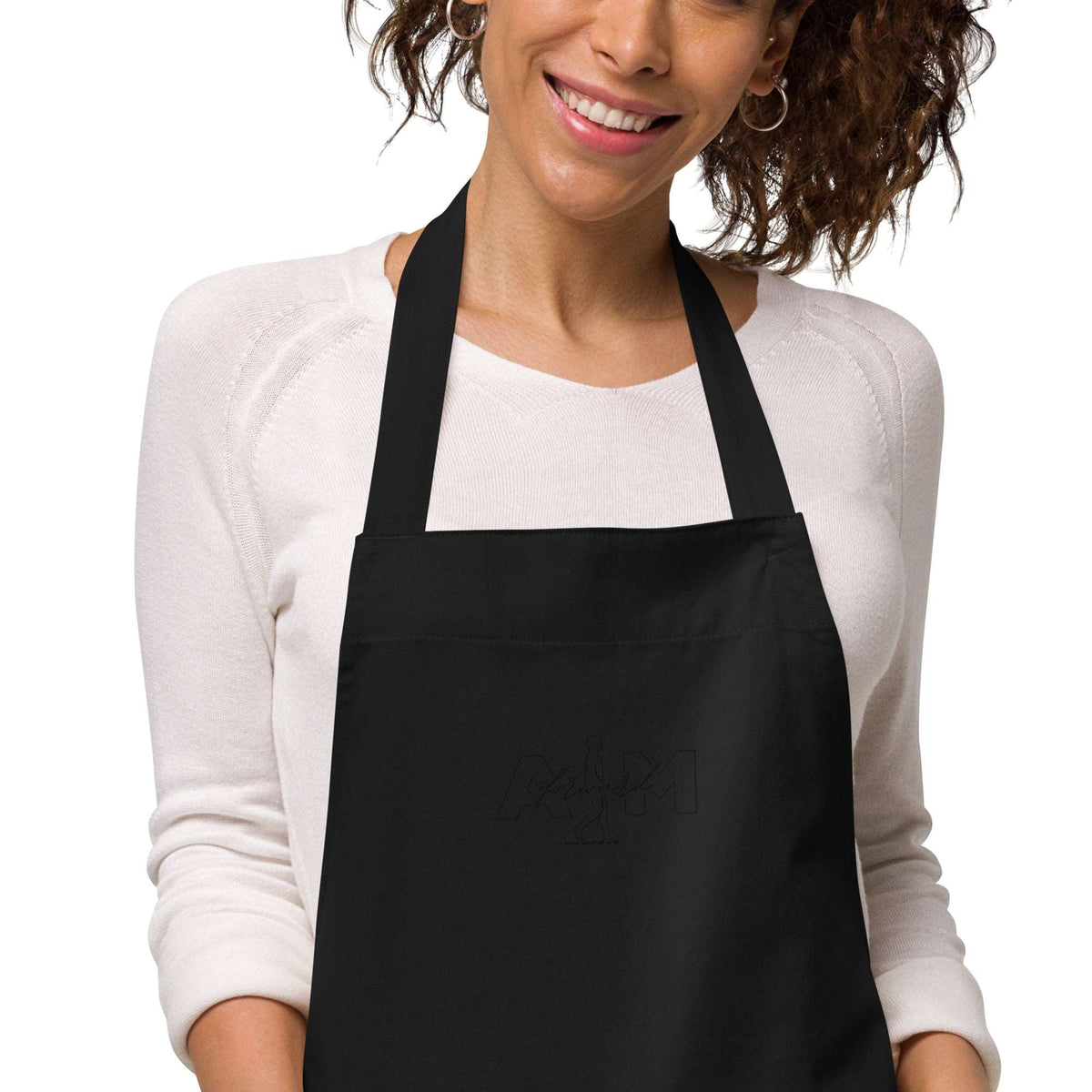 Organic cotton apron by AIM ATTITUDE featuring a durable design and adjustable straps, perfect for cooking or crafting.