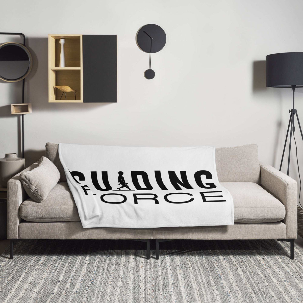 A cozy AIM ATTITUDE Guiding Force throw blanket with a vibrant design, perfect for adding warmth and style to any space.