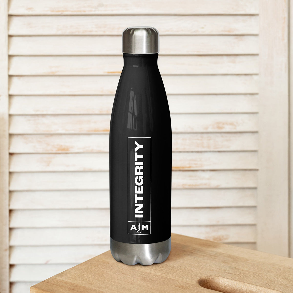 Stainless steel water bottle by AIM ATTITUDE with a sleek design, durable construction, and a secure screw-on lid.