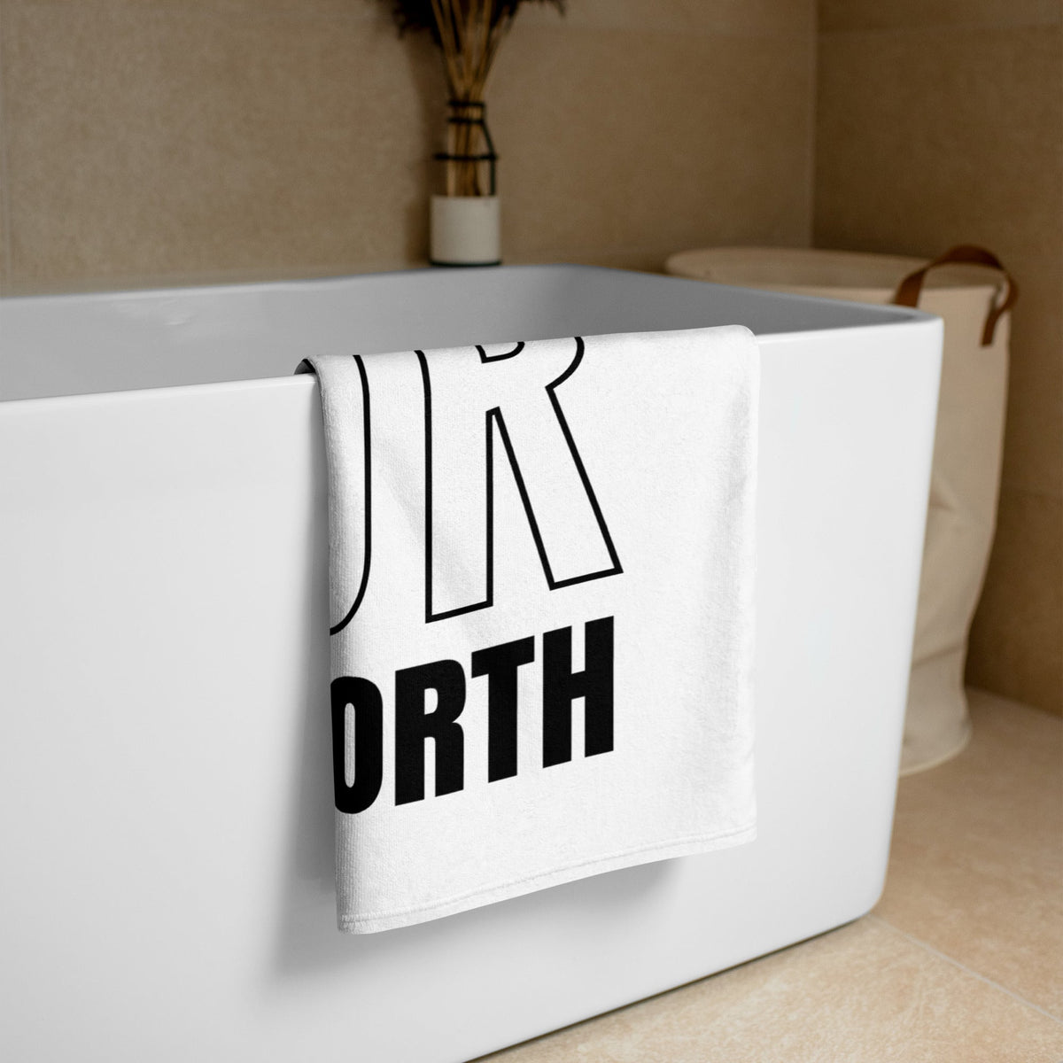 AIM Attitude Know Your Worth towel featuring motivational text, soft fabric, and stylish design for gym or beach use.