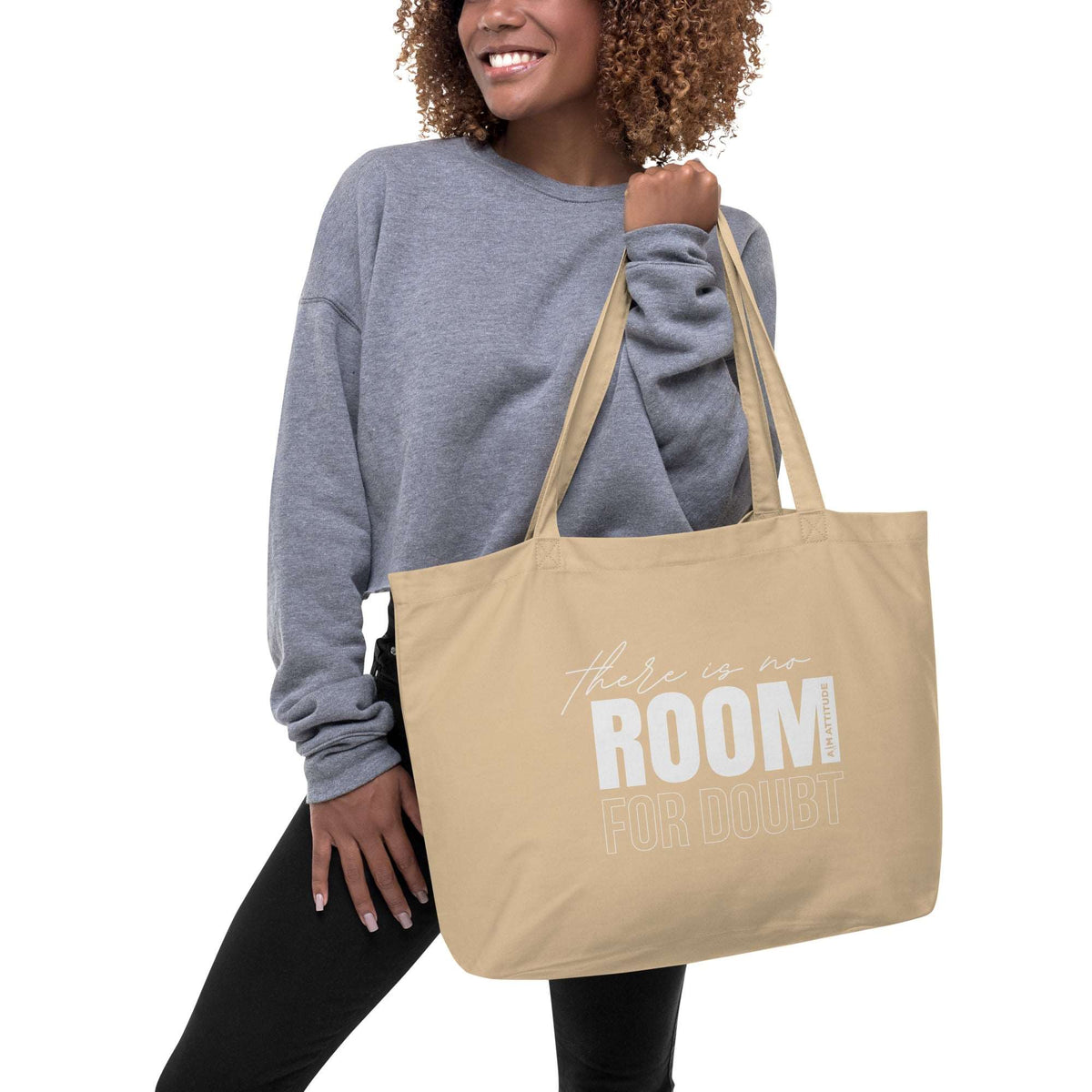 Large organic tote bag by AIM ATTITUDE with bold printed text "There Is No Room For Doubt" on natural canvas material.