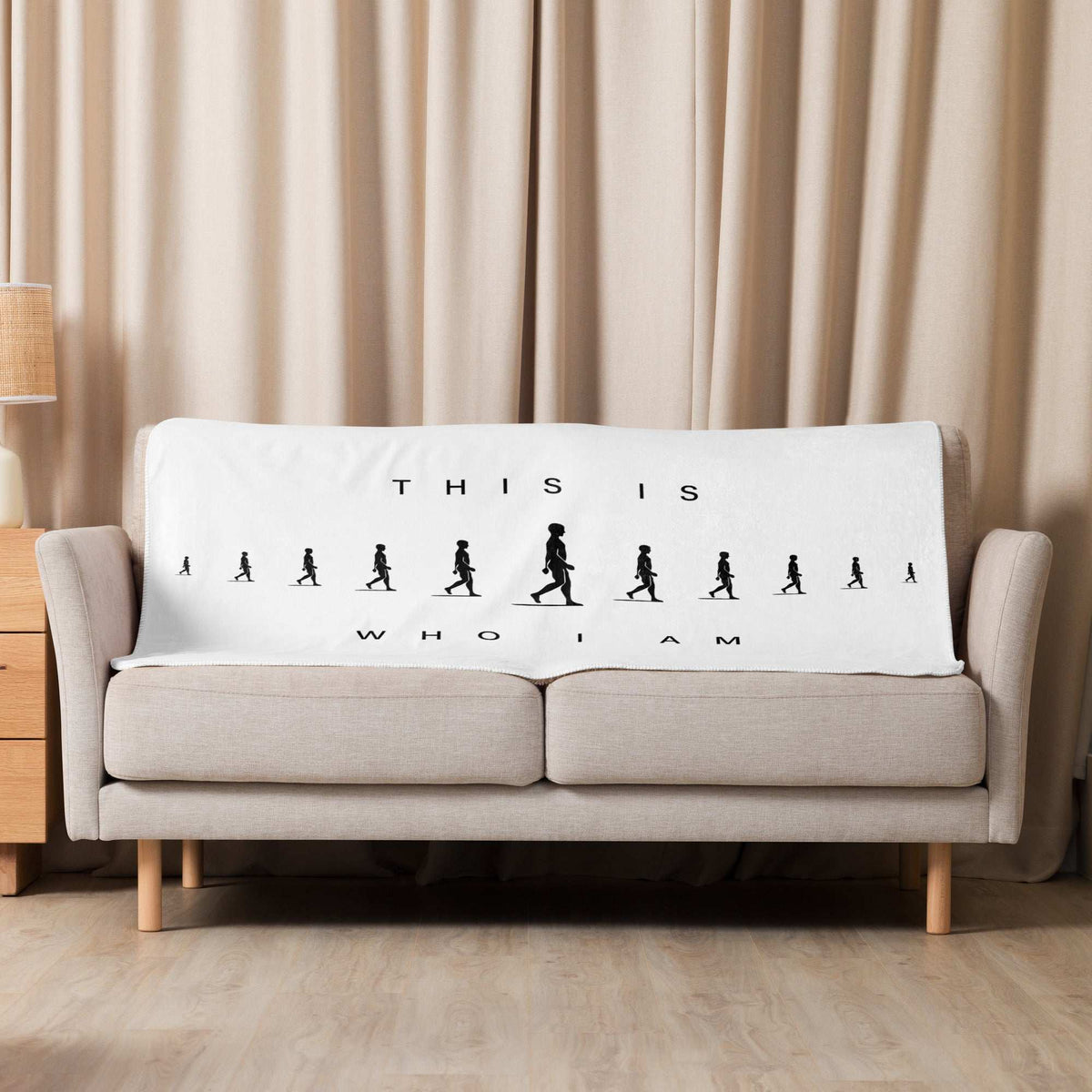 Soft AIM Attitude Sherpa blanket featuring "This Is Who I AM" design, cozy and warm for comfortable lounging.