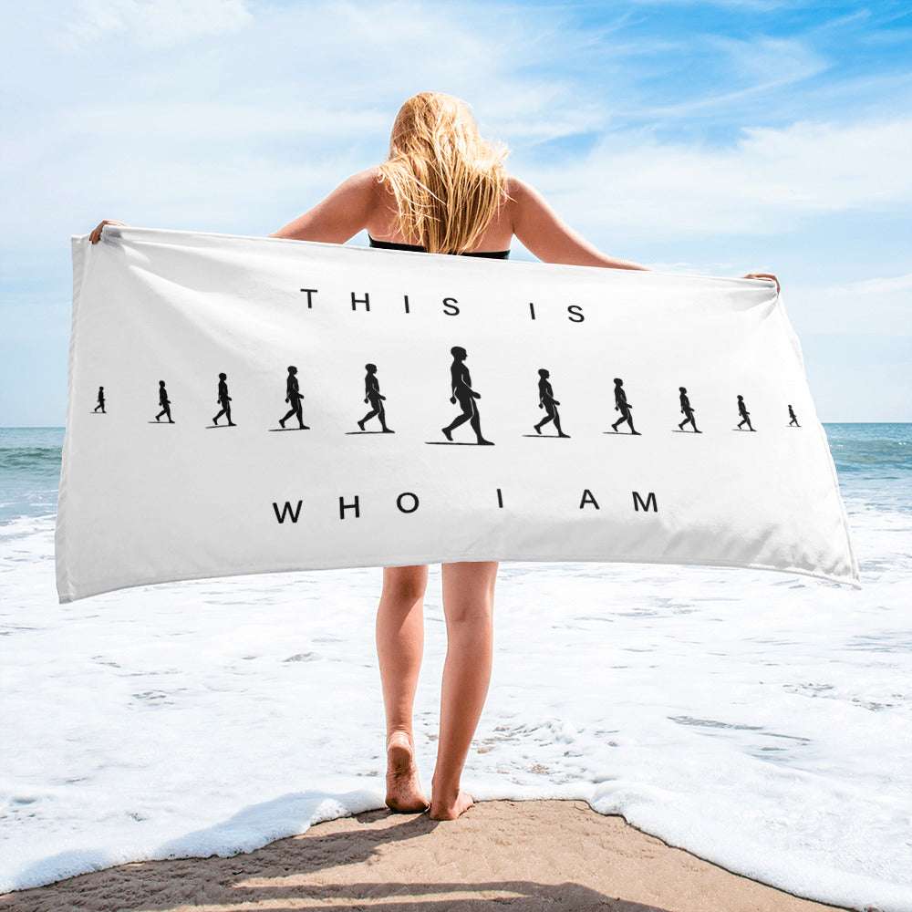 AIM ATTITUDE "This Is Who I Am" towel with bold text design, featuring soft fabric in a folded display.