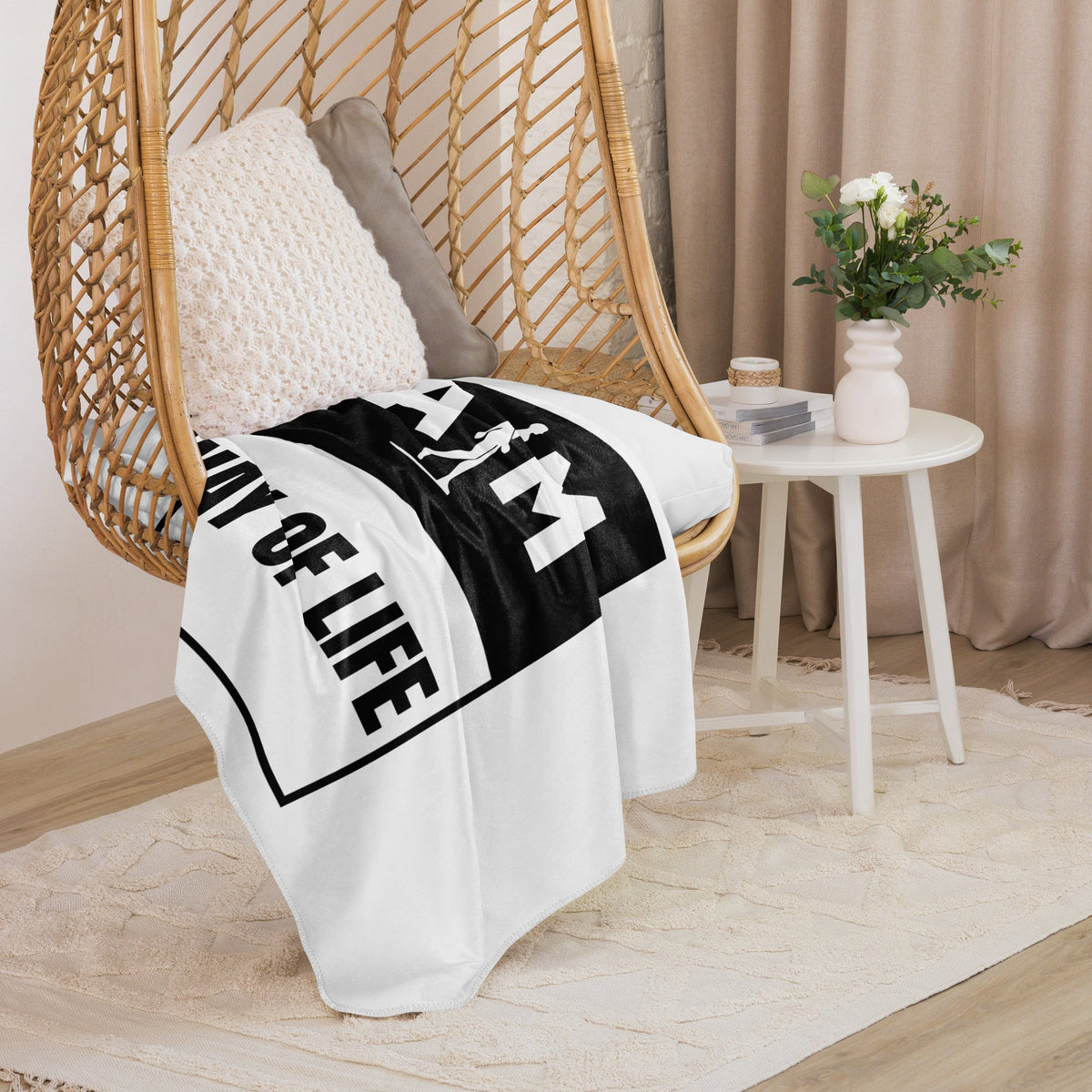 A cozy AIM ATTITUDE Way of Life Sherpa blanket with soft, plush fabric and stylish design, perfect for warm comfort at home.